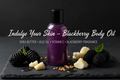 Blackberry Body Oil flat lay with dark background